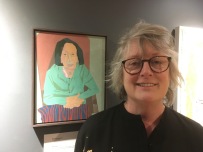 Maureen Nathan with her portrait.